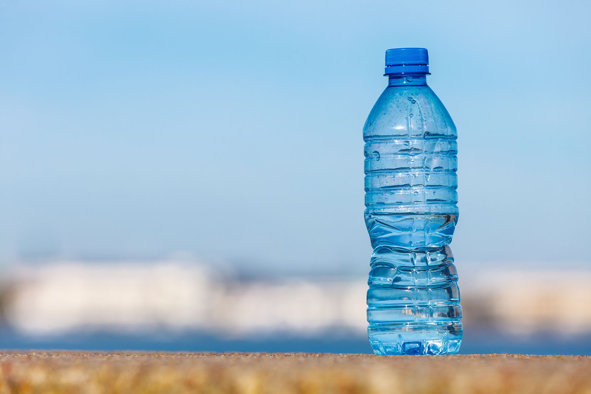 Water plastic bottle outdoor on sea shore